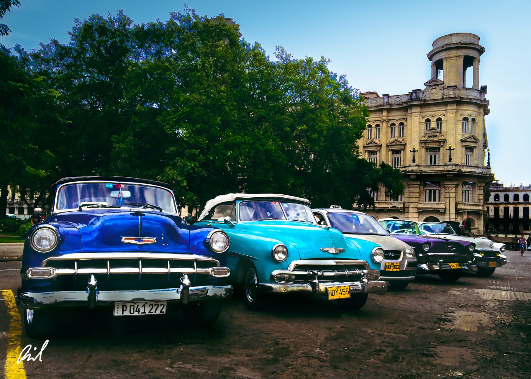 A group of Cubas parked in front of a building.